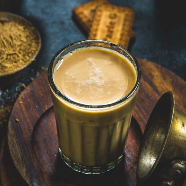 Masala Chai (Indian Spiced Milk Tea) is a very popular Indian drink made using black tea leaves, milk, and aromatic spices. It comes together in under 10 minutes using 6 ingredients and one pot. Learn to make this authentic Indian beverage at home (vegetarian, gluten-free).