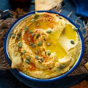 This creamy Savory Pumpkin Hummus gets ready in under 10 minutes and makes for a great fall-flavored party appetizer. Serve it with pita bread or nachos for a yummy treat (vegan, gluten-free).