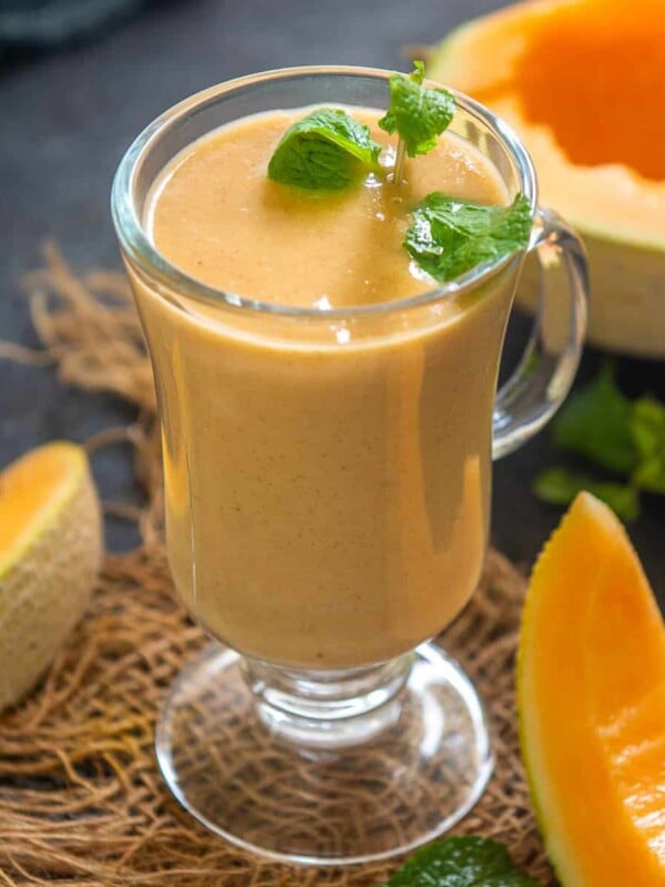 Make this creamy, rich, and super healthy cantaloupe smoothie with just 4 ingredients in 5 minutes. Serve this summer smoothie for breakfast, snack, or dessert (gluten-free, can be made vegan).