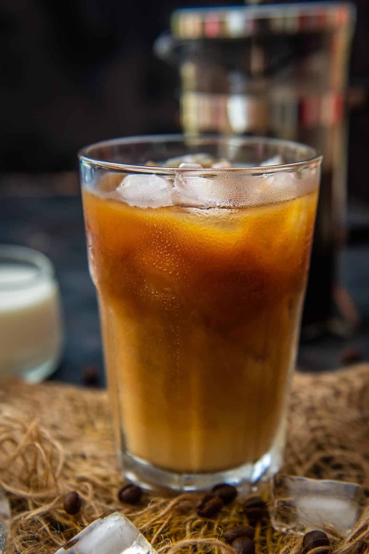 Close up shot of french press cold brew in a glass.