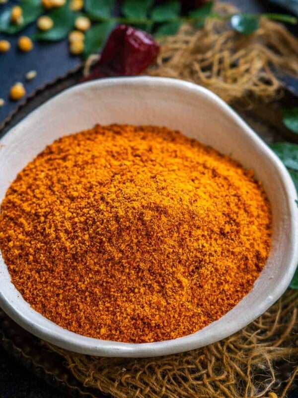 Idli Podi (Milagai Podi) is a South Indian condiment that is popularly served with steamed idli. It is earthy, smoky, spicy, and slightly crunchy and you can make a big batch in just 20 minutes.