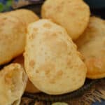 Bhatura is a fluffy, puffed, and deep-fried Indian bread (Punjabi) that is famously served with golden brown chickpea curry (chole) in India. Learn how to make Punjabi Bhatura at home using my easy, no yeast recipe.