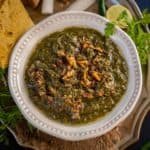 Sarson Ka Saag is a traditional Punjabi dish made using mustard greens and other leafy vegetables and a delicious tempering of onion and garlic in ghee. Served with a dollop of White Butter (Makkhan) and crispy warm Makki Ki Roti, this dish is soul-warming.