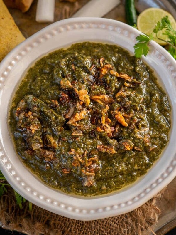 Sarson Ka Saag is a traditional Punjabi dish made using mustard greens and other leafy vegetables and a delicious tempering of onion and garlic in ghee. Served with a dollop of White Butter (Makkhan) and crispy warm Makki Ki Roti, this dish is soul-warming.