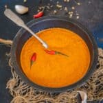Make this North African & Middle Eastern Spicy Harissa Sauce at home using a few simple ingredients. It is vibrant red in color and adds smokiness and heat to whatever it is added to (vegan, gluten-free).