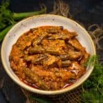 Achari Bhindi (Okra Curry In Pickling Spices) is a tangy, spicy Indian okra curry that pairs perfectly with Indian bread or rice. It has a special achari masala (pickling spices) added, giving it a unique flavor.