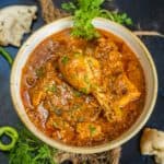 Achari Chicken Curry is a North Indian-style curry flavored with pickling spices (achar masala). It goes great with Indian bread or rice dishes. Make it in a pan over the stovetop or in an instant pot.