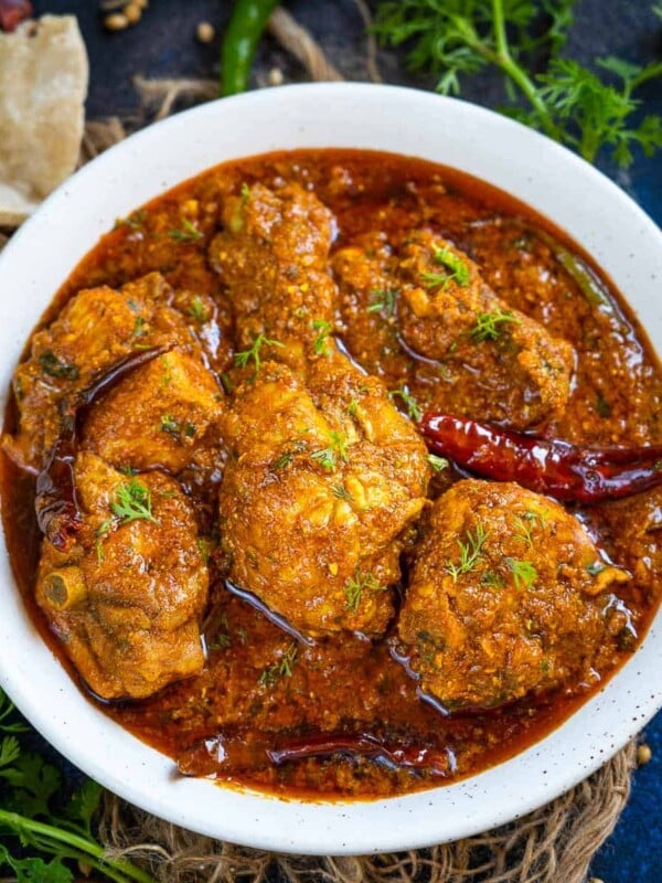 Chicken Masala Curry is a bold, spicy, and super flavorful Indian chicken curry made by cooking chicken in an onion tomato-based gravy. Make it in restaurant style using my easy recipe (gluten-free).