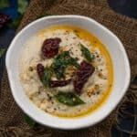 Coconut Chutney (Thengai Chutney, Nariyal Chutney) is a classic South Indian condiment that is served with dosa, idli, vada, and also as a part of a meal. Made with fresh coconut, it is one of the most versatile chutneys that pairs well with any South Indian snack or breakfast.