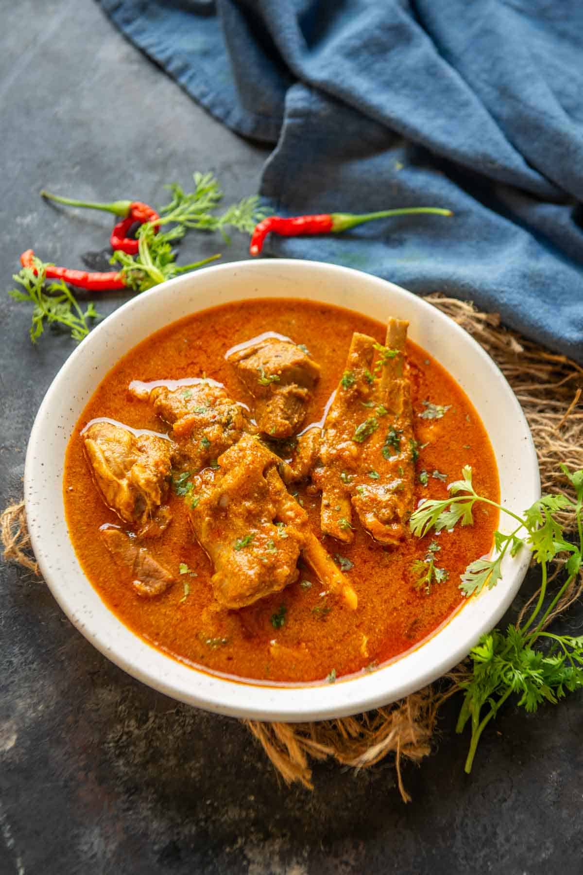 Mutton kulambu served in a bowl.