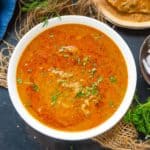 Salna (Empty Parotta Chalna) is a South Indian street-style curry made with onion and tomato as its base ingredients. This recipe is easy to make at home and requires only pantry staples.