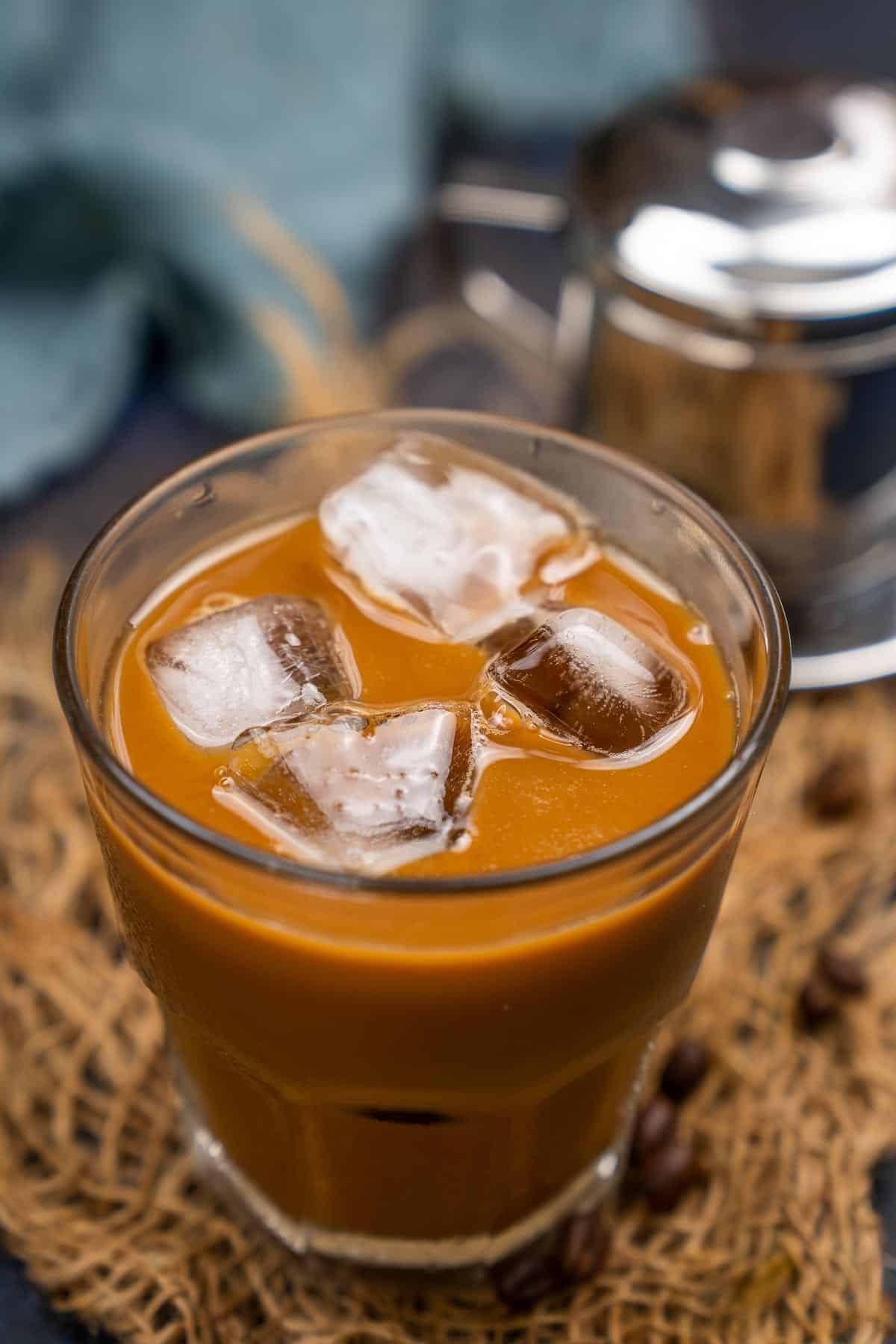 Vietnamese coffee served in a glass.