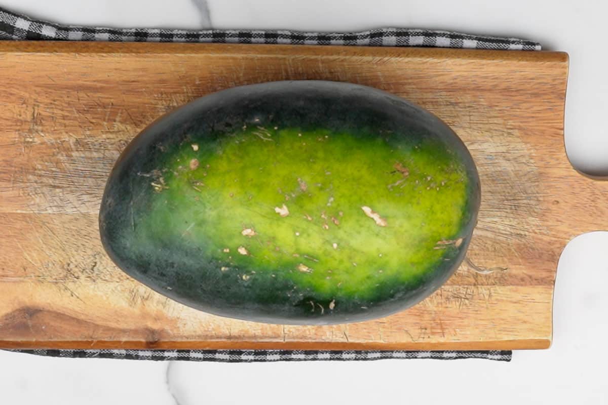 Whole watermelon kept on the counter.