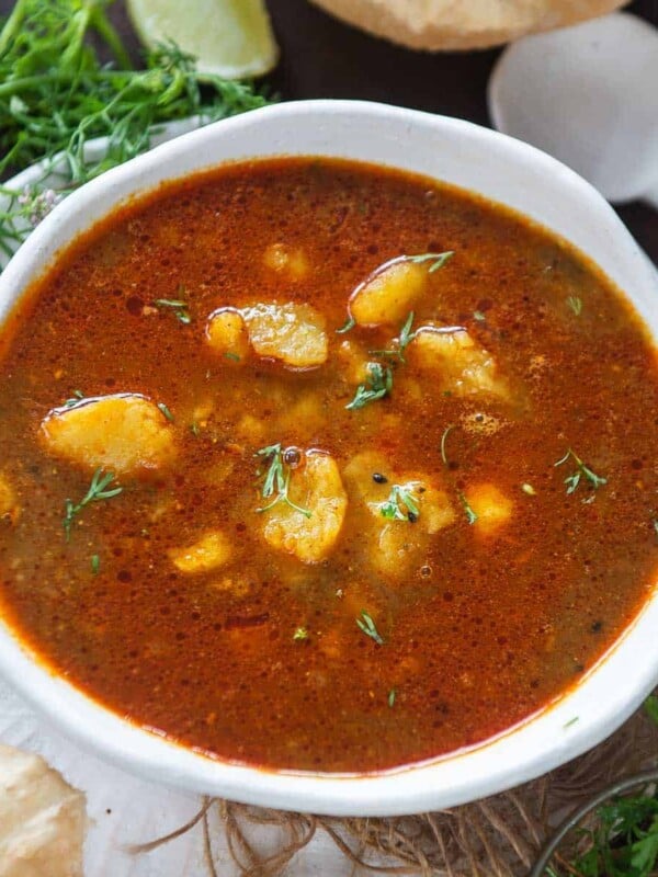 Aloo ki launji is a Punjabi-style sweet and spicy potato curry. It pairs very well with poori and paratha and can be made in under 20 minutes using simple ingredients.