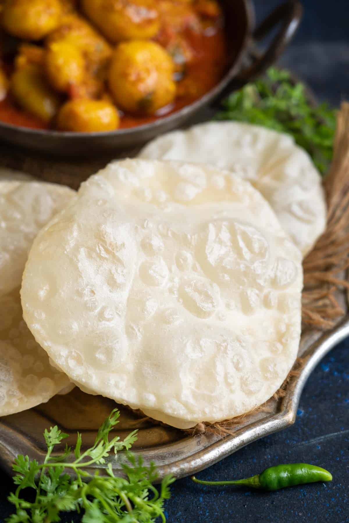 Bengali luchi served on a plate.