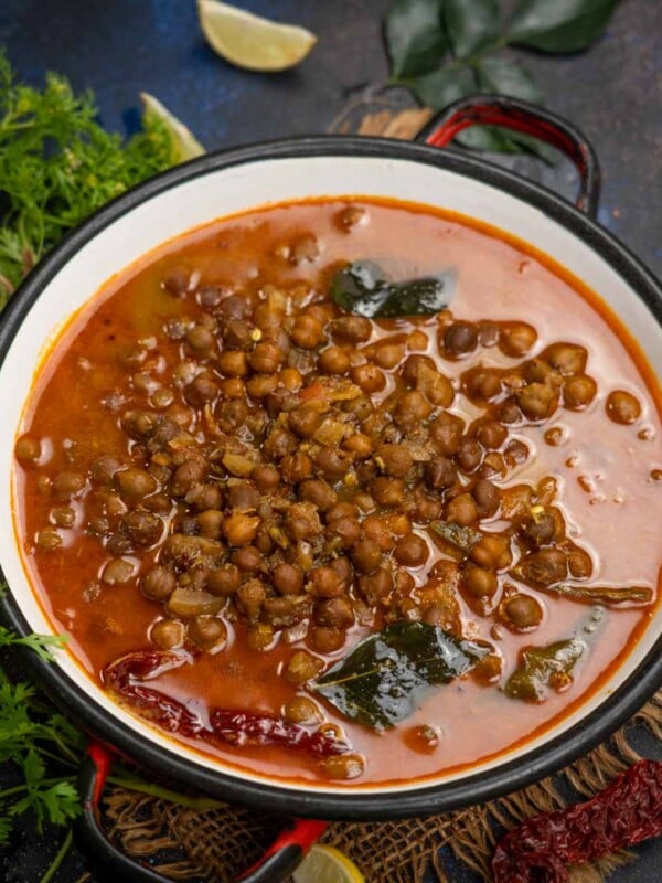 Kadala Curry (Kerala-Style Black Chickpeas Kari) is a quintessential dish in every Malayalee household. It’s a very popular dish to serve with puttu, appam, and dosa for breakfast and is also eaten with idiyappam or string hoppers, paratha, and boiled red rice for lunch or dinner (vegan, can be easily made gluten-free).