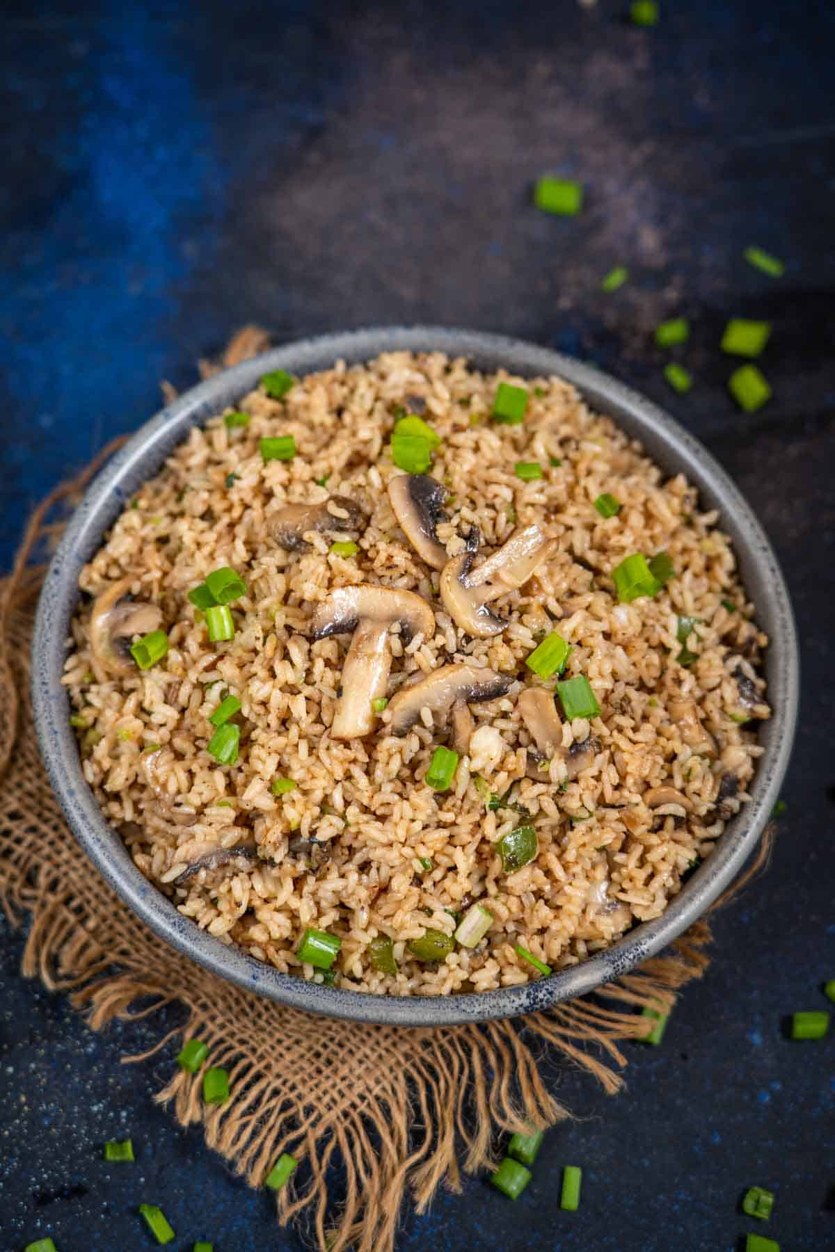 Chinese mushroom fried rice served in a bowl.