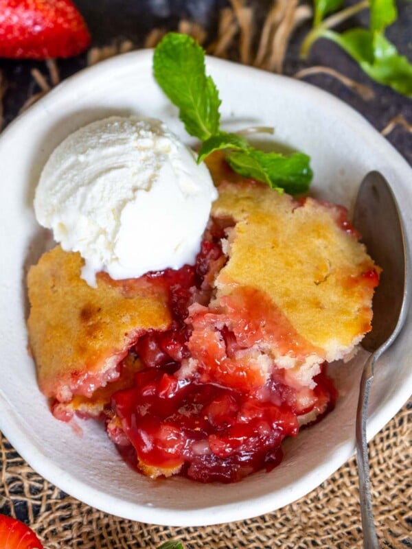 This Easy Homemade Strawberry Cobbler comes together using simple ingredients in under 10 minutes of active working time. Make it for a get-together, house party, or after-meal dessert.