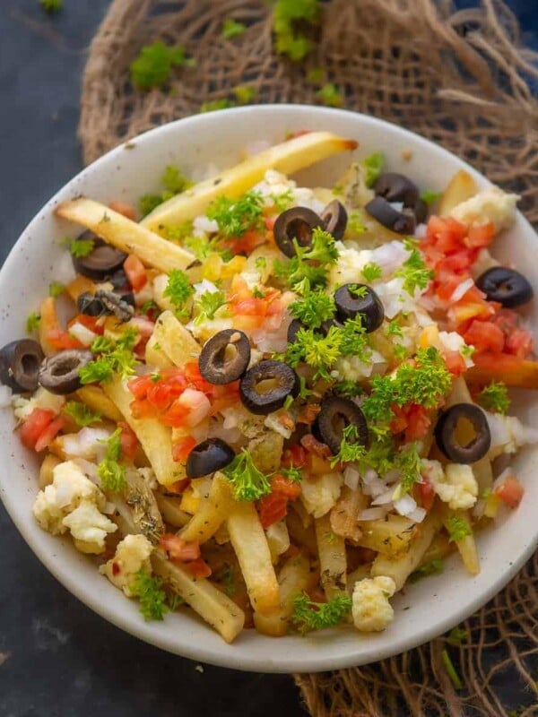 Make these extra crispy Greek Fries in just 15 minutes. Serve them as an appetizer or a side dish for a unique homemade treat (gluten-free).