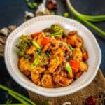 Make this hot and spicy takeout copycat Chinese Hunan Chicken at home in under 30 minutes. It's budget-friendly and loaded with colorful veggies, and the spices can be adjusted to your taste.