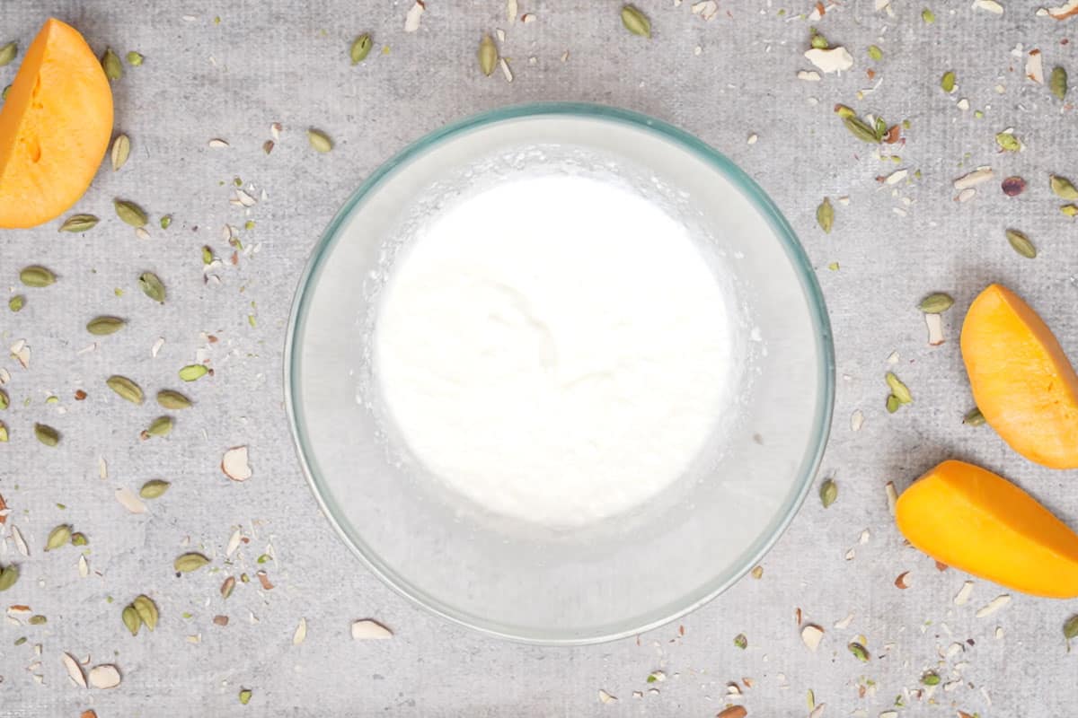 Yogurt whisked in a bowl.