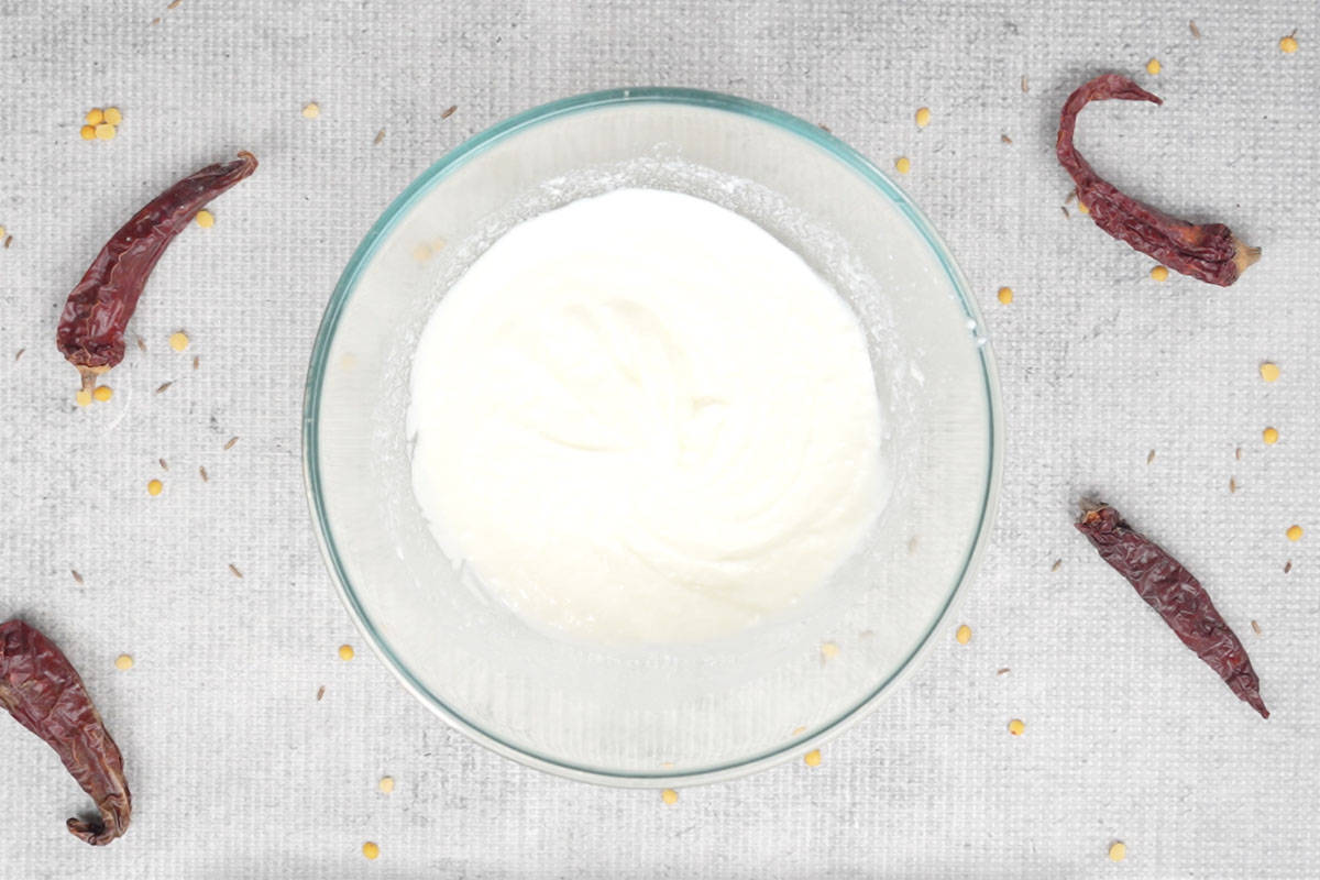 Yogurt whisked in a bowl.