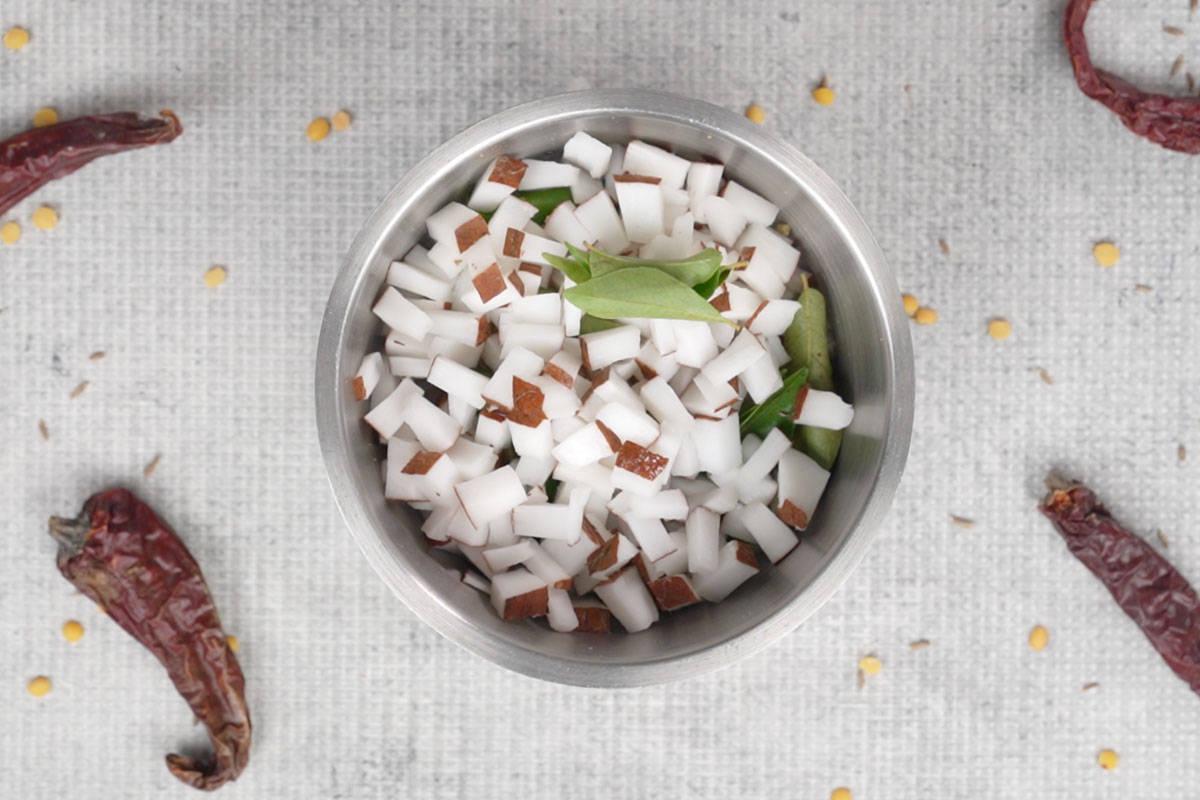 Cumin seeds, ginger, green chilies, coconut, curry leaves and water added to a the blender.