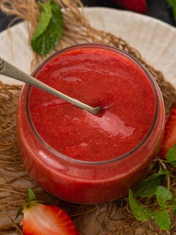 This 3 ingredient strawberry coulis is super versatile and can be made using fresh or frozen strawberries. Use it to top cheesecake, ice cream, frozen yogurt, rice pudding, and what not!