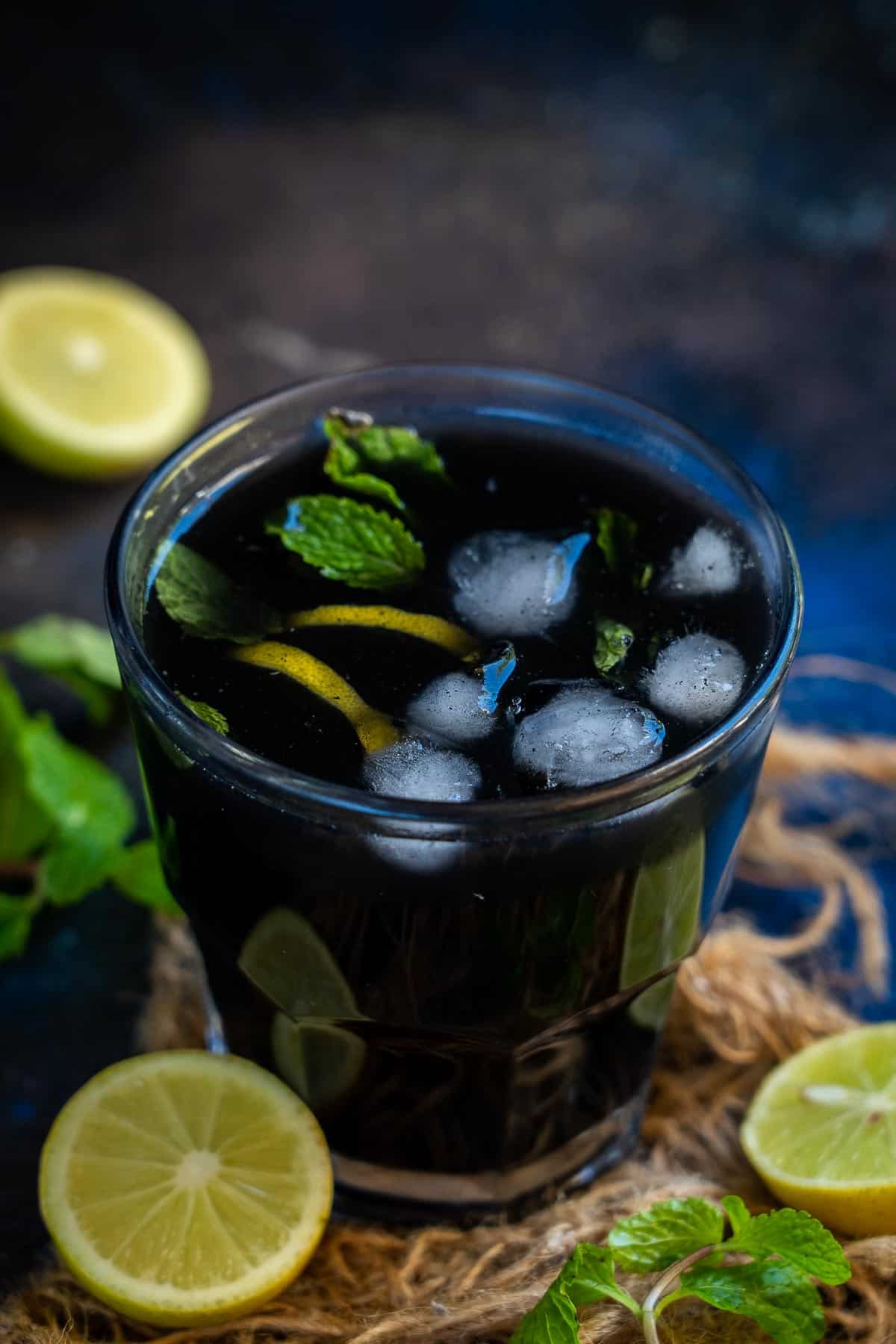 Activated charcoal lemonade served in a glass.