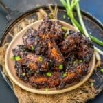 Gochujang chicken wings served in a plate