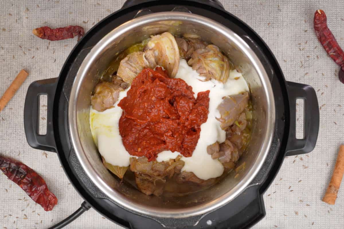 Yogurt and chili paste added to the pot.