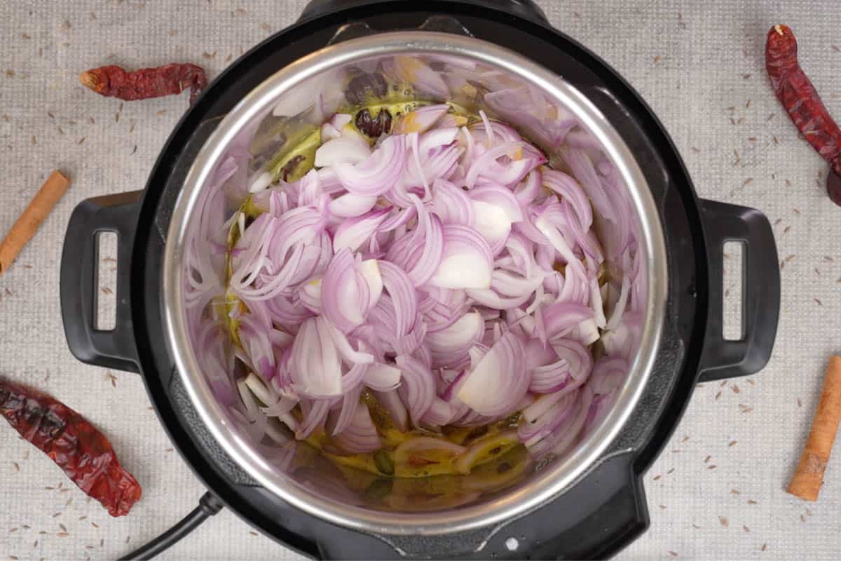 Onions added to the pot.