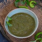 Mint chutney served in a bowl.