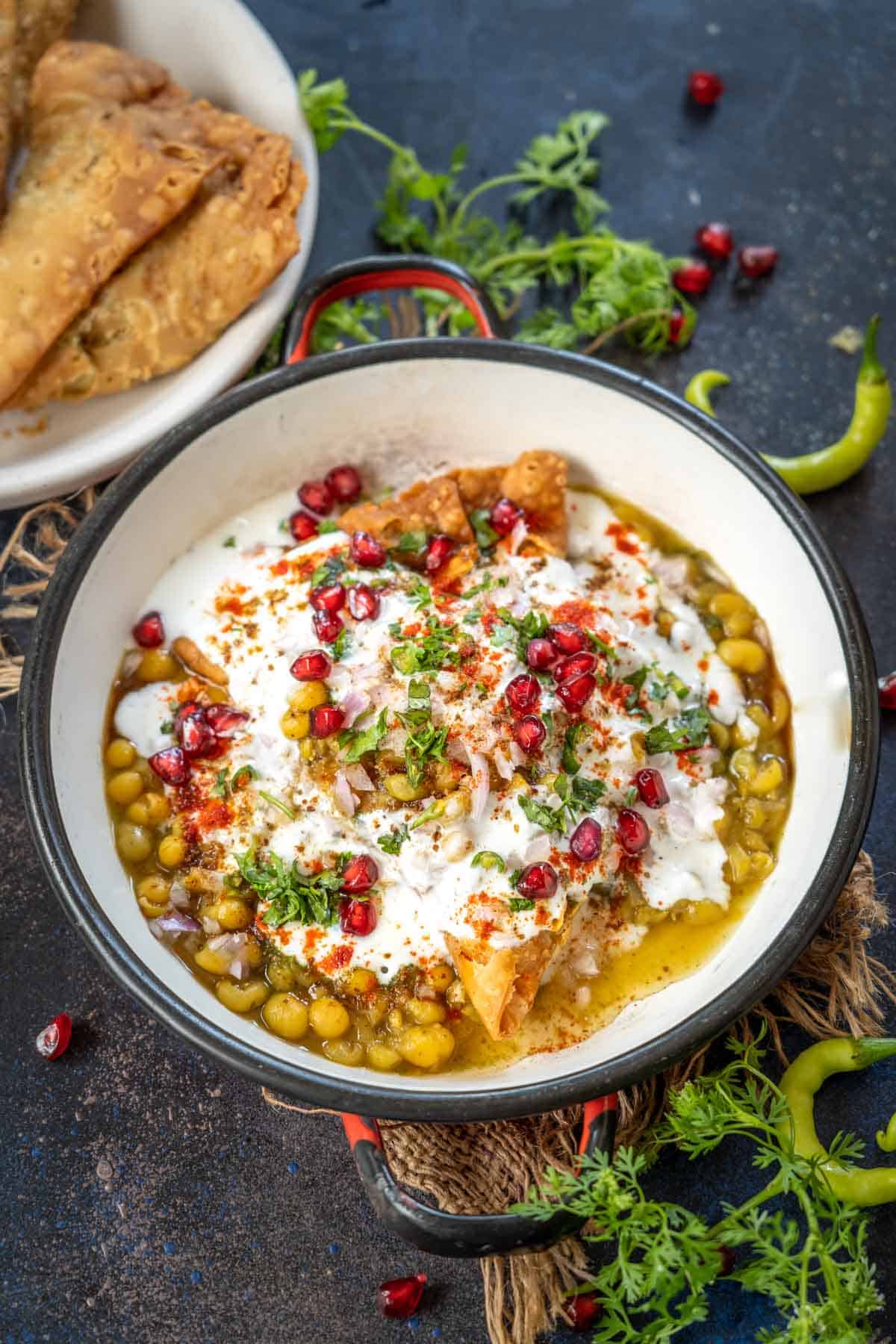 Samosa chaat served on a plate.