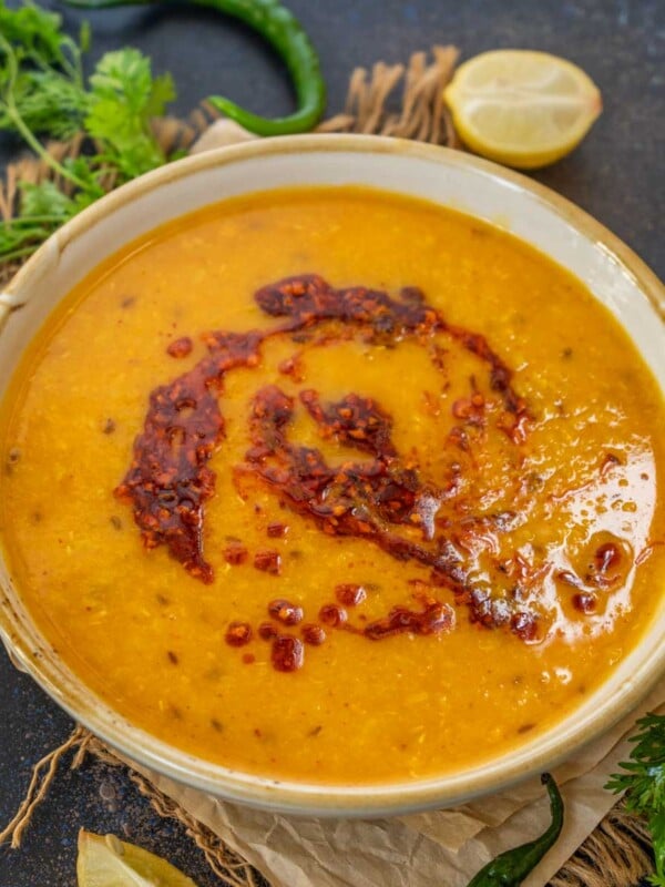 This Yellow Moong Dal Tadka is a simple North Indian style lentil dish where split and skinned yellow mung lentils are cooked until creamy and then tempered with a spicy tempering. Use my easy recipe to make it in an instant pot or on a stovetop pressure cooker.