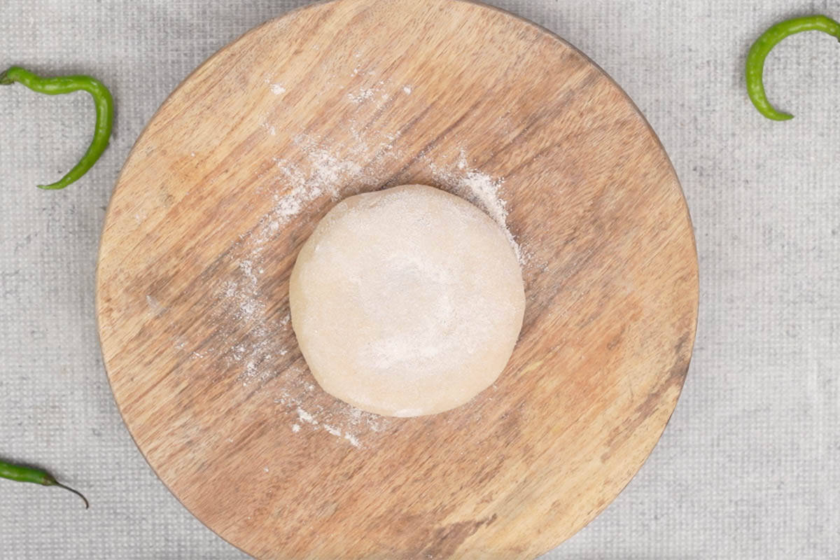 Filled dough made into a smooth round and dusted with dry flour.