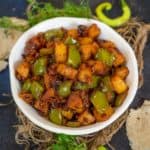 Dry Aloo Capsicum (Aloo Shimla Mirch) is an Indian stir fry made using potatoes and green bell peppers. Serve it for lunch or dinner with dal and roti or pack for lunch boxes with paratha.