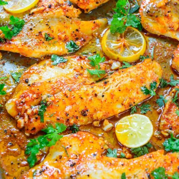 This Spicy Lemon Garlic Baked Tilapia Recipe is super easy to make and comes together in under 20 minutes. It's low-carb, gluten-free, keto-friendly, and very flavorful.