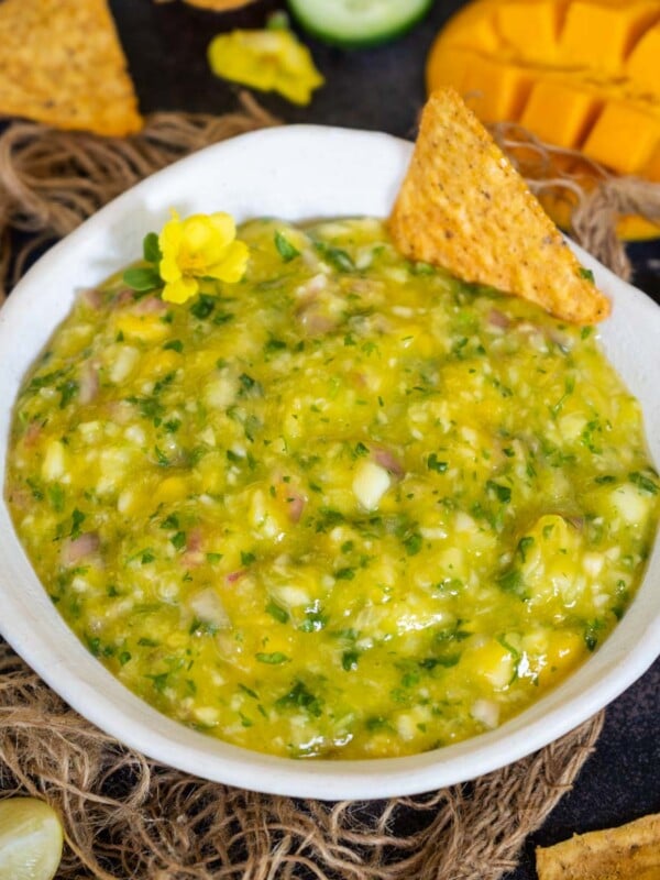 Mango Cucumber Salsa is a spicy and tangy dip perfect for serving with grilled meat, veggies, tacos, nachos, or chips. Make it in under 10 minutes of active working time using simple ingredients (vegan, gluten-free, paleo, whole 30).