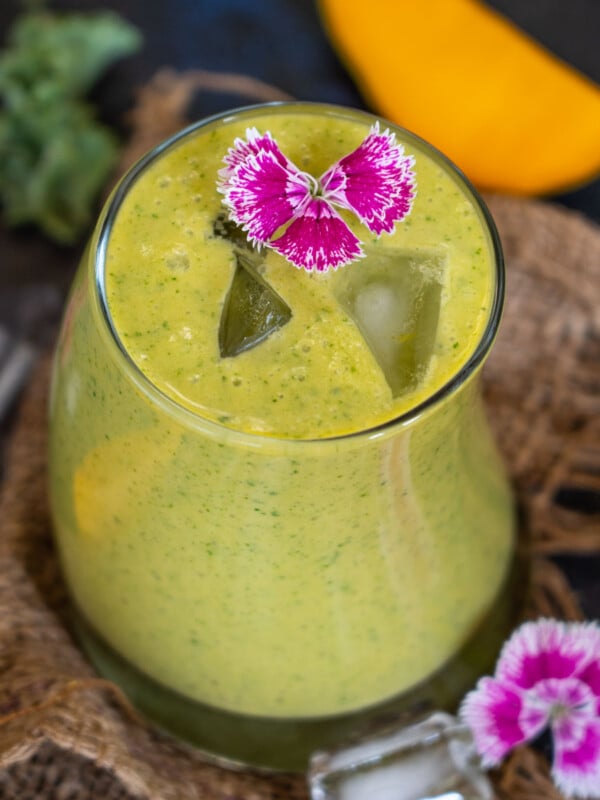 Made with 6 ingredients in under 5 minutes, this Mango Kale Smoothie is packed with antioxidants and vitamins. It is easy to make, super creamy, and perfect for busy summer mornings.