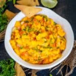 This Easy Mango Pico De Gallo (Mango Salsa) is fruity, sweet, and spicy and comes together using simple ingredients. Serve it with nachos, chips, rice, or tacos for a perfect summer special accompaniment (vegan, gluten-free, dairy-free, keto, low-carb).