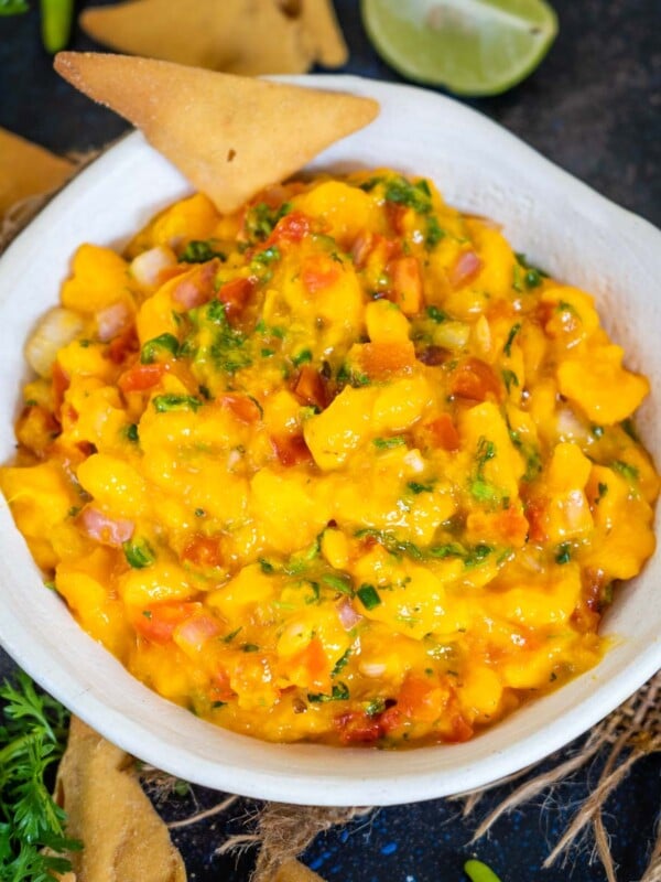 This Easy Mango Pico De Gallo (Mango Salsa) is fruity, sweet, and spicy and comes together using simple ingredients. Serve it with nachos, chips, rice, or tacos for a perfect summer special accompaniment (vegan, gluten-free, dairy-free, keto, low-carb).