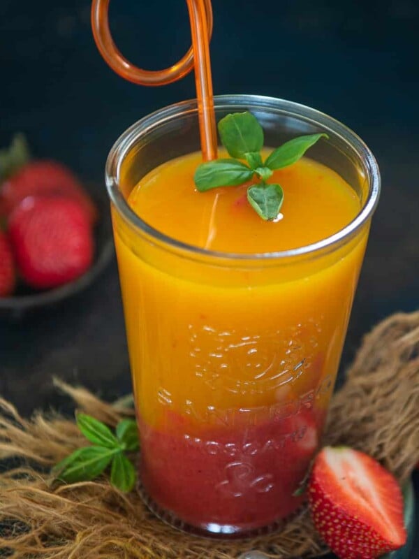 Mango Strawberry Sunrise is a refreshing summer drink that comes together in just a minute using 3 ingredients. This sweet, and fruity beverage is perfect to make for get-togethers or potluck parties. Here is how to make it (vegan, gluten-free).