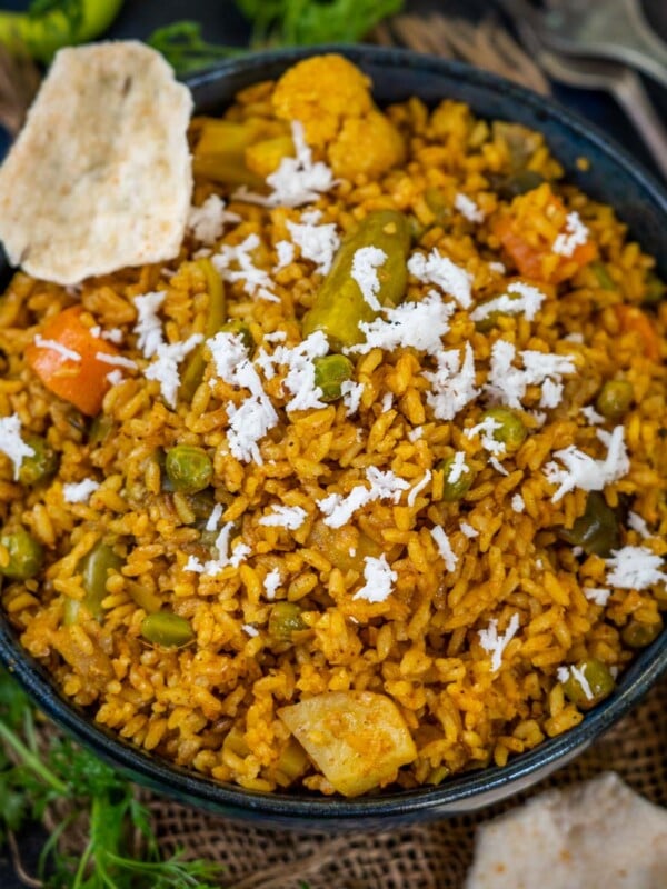 Spicy and packed with delicious flavors, Maharashtrian Masale Bhat is the perfect comfort food that comes together in under 30 minutes. Make this traditional one-pot, vegan dish using a medley of vegetables and a hot spice mix - Goda Masala (vegan, can be easily made gluten-free).