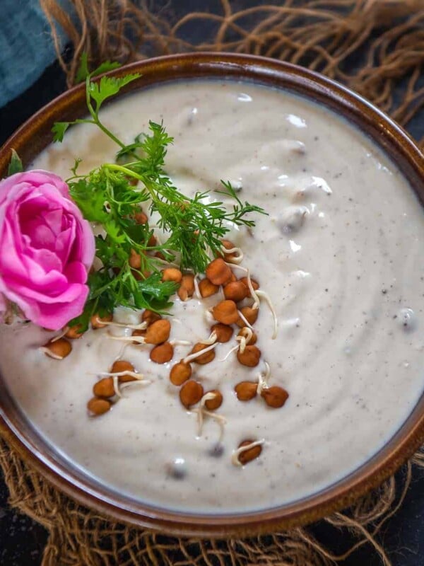 Bored of your usual raita recipes? Then try this Sprouted Chickpea Raita to serve with your Indian meals. It is easy, protein-rich, and a perfect accompaniment for your summer meals. Here is how to make it (vegetarian, gluten-free).
