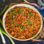 This Korean Gochujang Fried Rice comes together in just 15 minutes and makes for a great main course or side dish. Load it up with veggies, eggs, bacon, or meat of your choice for a spicy treat.