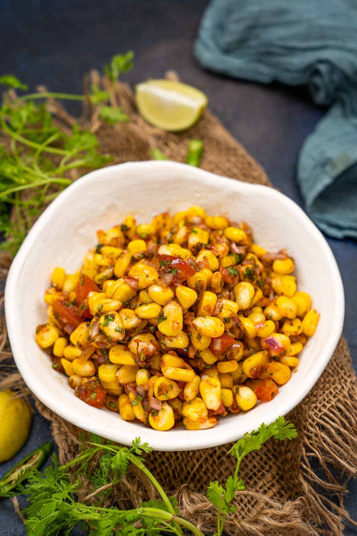 Indian flavored sweet corn chaat served in a bowl.