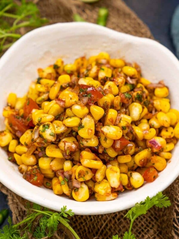 Corn Chaat is a spicy, tangy, and savory snack made using tender sweetcorn, onion, tomatoes, and a few herbs and spices. This super easy recipe comes together in under 15 minutes and is very healthy too.