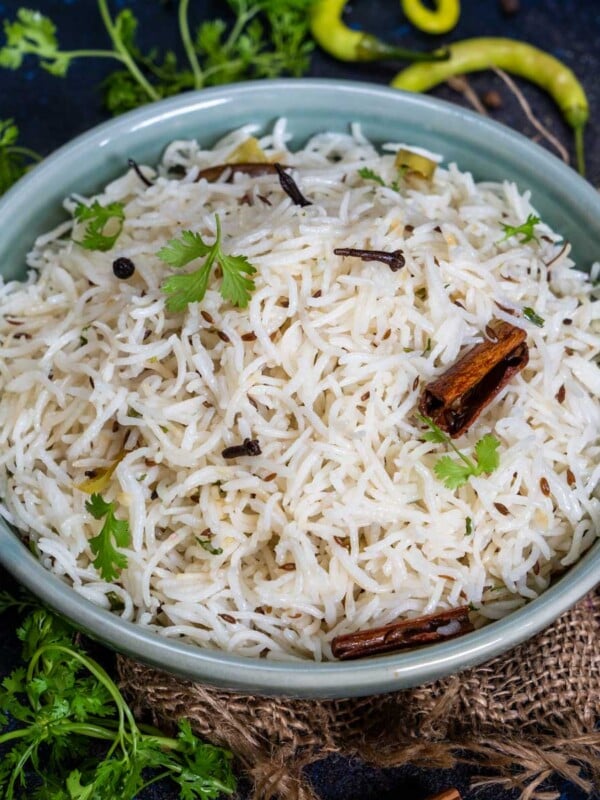 Jeera Rice (Indian Cumin Rice) is an Indian rice dish made using rice, cumin seeds, and a few other spices. My recipe tastes exactly like the one served at your favorite restaurant - fluffy, perfectly cooked, non-sticky, aromatic, and flavorful. Make it using simple ingredients in a pan, instant pot, or a stovetop pressure cooker (vegetarian, gluten-free, and can be easily made vegan).