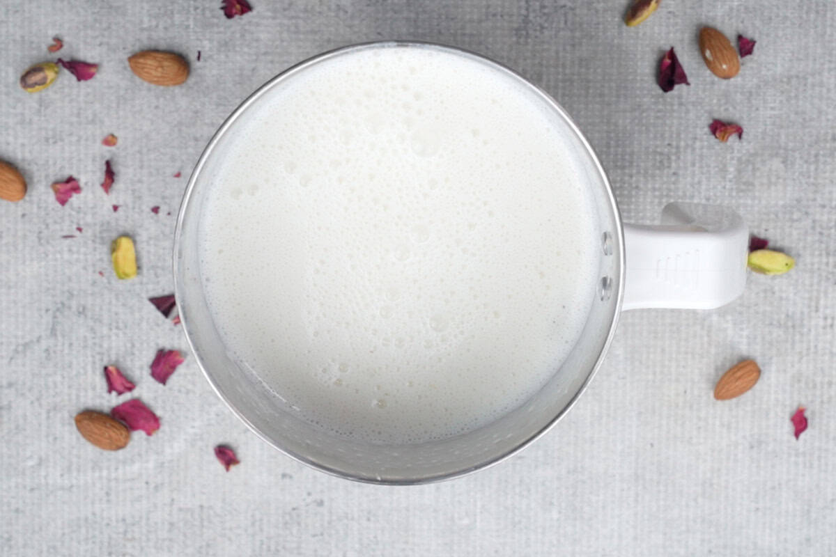 Frothy lassi in the blender jar.
